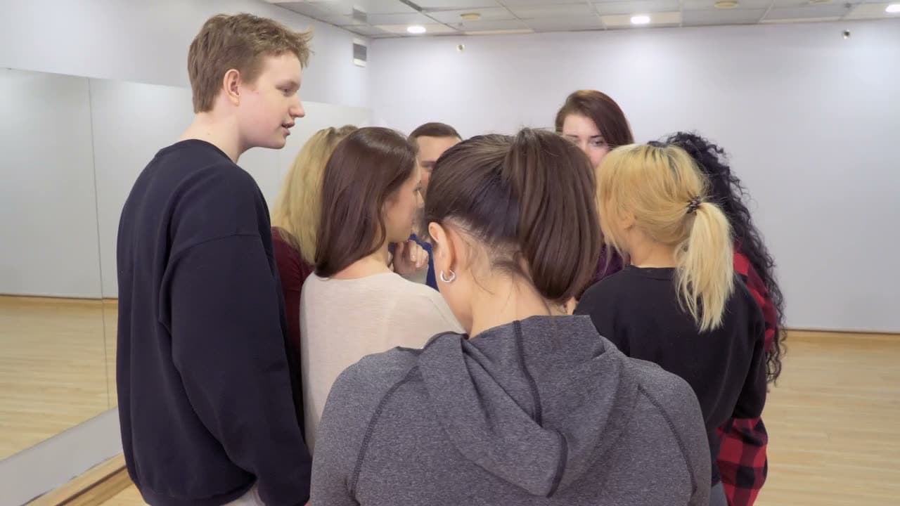 A diverse team of young professionals working through a plan together